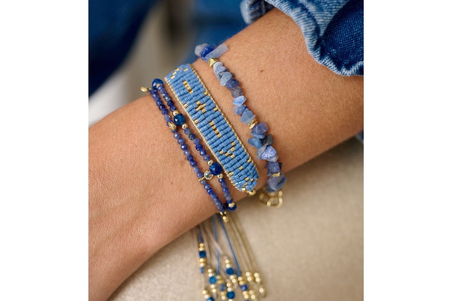 A beautiful Blue Aventurine crystal gold stretch bracelet with rough-cut gemstones and a filigree Boho Betty gold charm. A meaningful and calming jewellery gift for her.