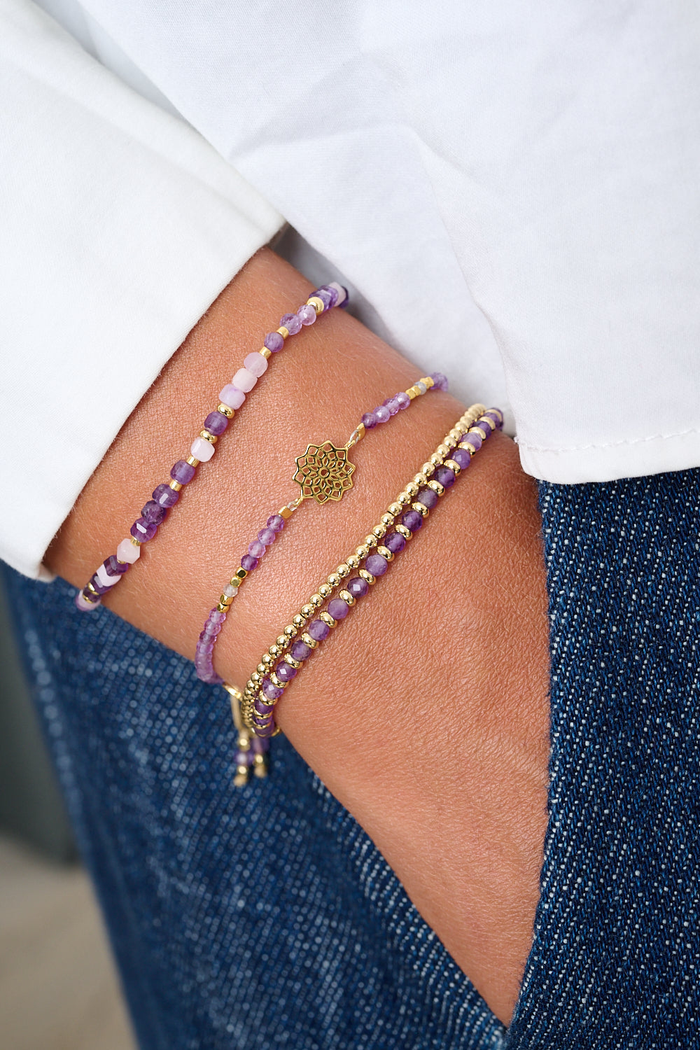 Violet Gold & Amethyst Mix Gemstone Bracelet featured on wrist with Boho Betty stacking bracelets in a boho chic setting