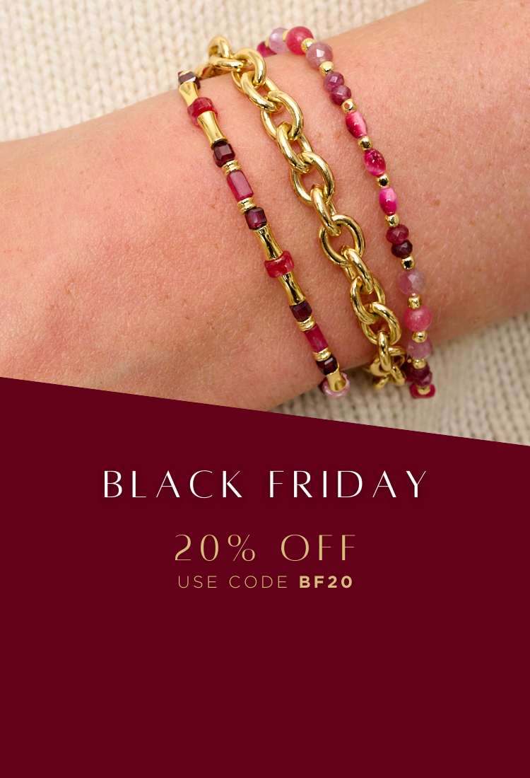 Red garnet beaded bracelet styled with chunky gold chain bracelet with a cream knitted jumper for Black Friday Sale