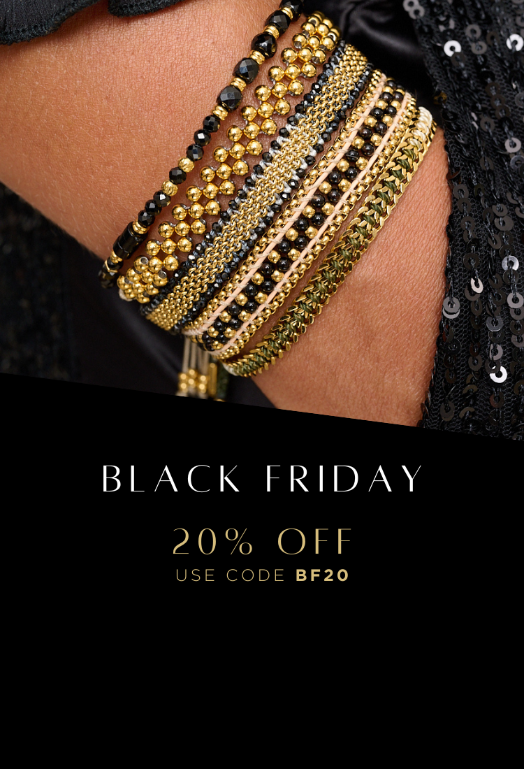 Black beaded bracelets with gold beaded bracelets and hand woven bracelet paired together and styled with a black sequin skirt ready for the christmas party season