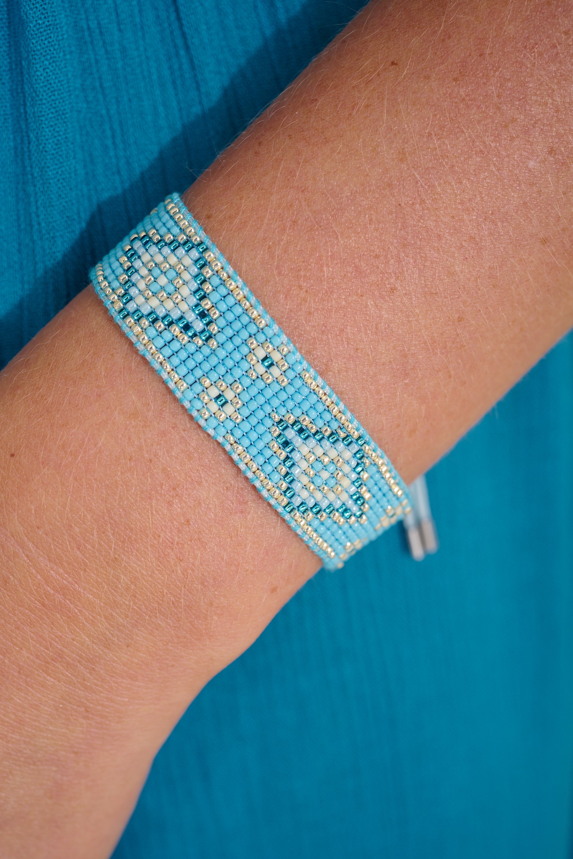 Carys Pale Blue Silver Friendship Bracelet styled on wrist with silver accents and soft blue Miyuki beads—perfect for layering or gifting.