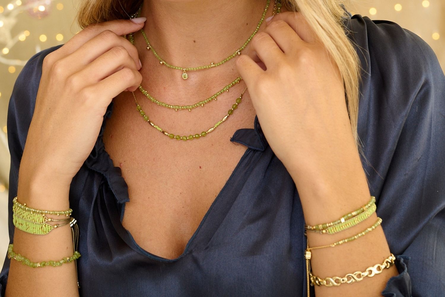 Holly Peridot Necklace and Bracelet Set styled for summer adventures, with vibrant Peridot gemstones and golden accents, perfect for beach days, garden parties, and golden-hour celebrations.