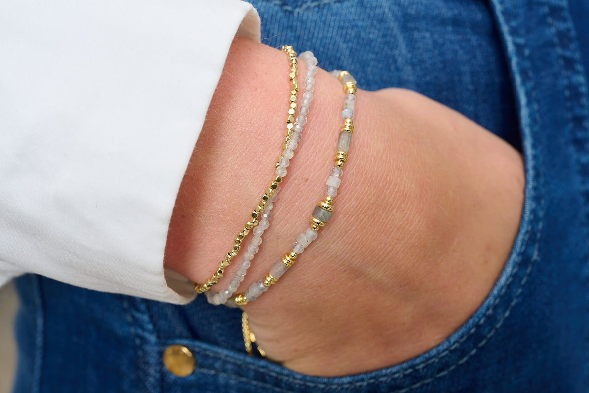 Juniper Gold & Labradorite Double Strand Bracelet styled in a boho bracelet stack with shimmering labradorite gemstones and golden accents.
