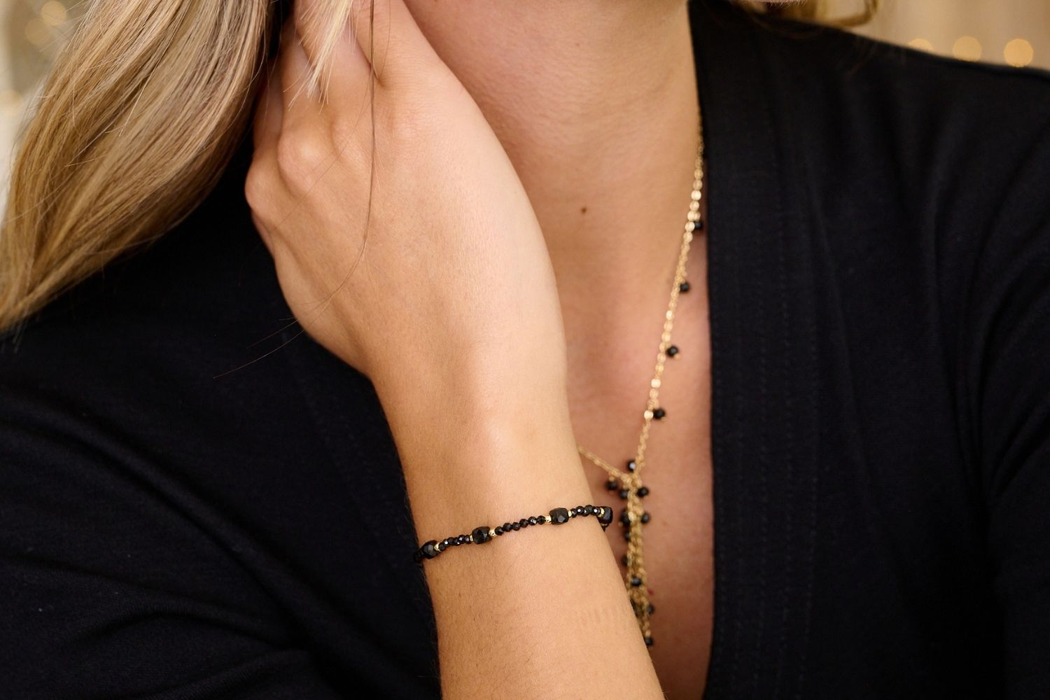 Meadow Gold & Black Spinel Gemstone Slider Bracelet styled on the wrist, featuring black Spinel beads and gold accents, perfect for wearing solo or layering.