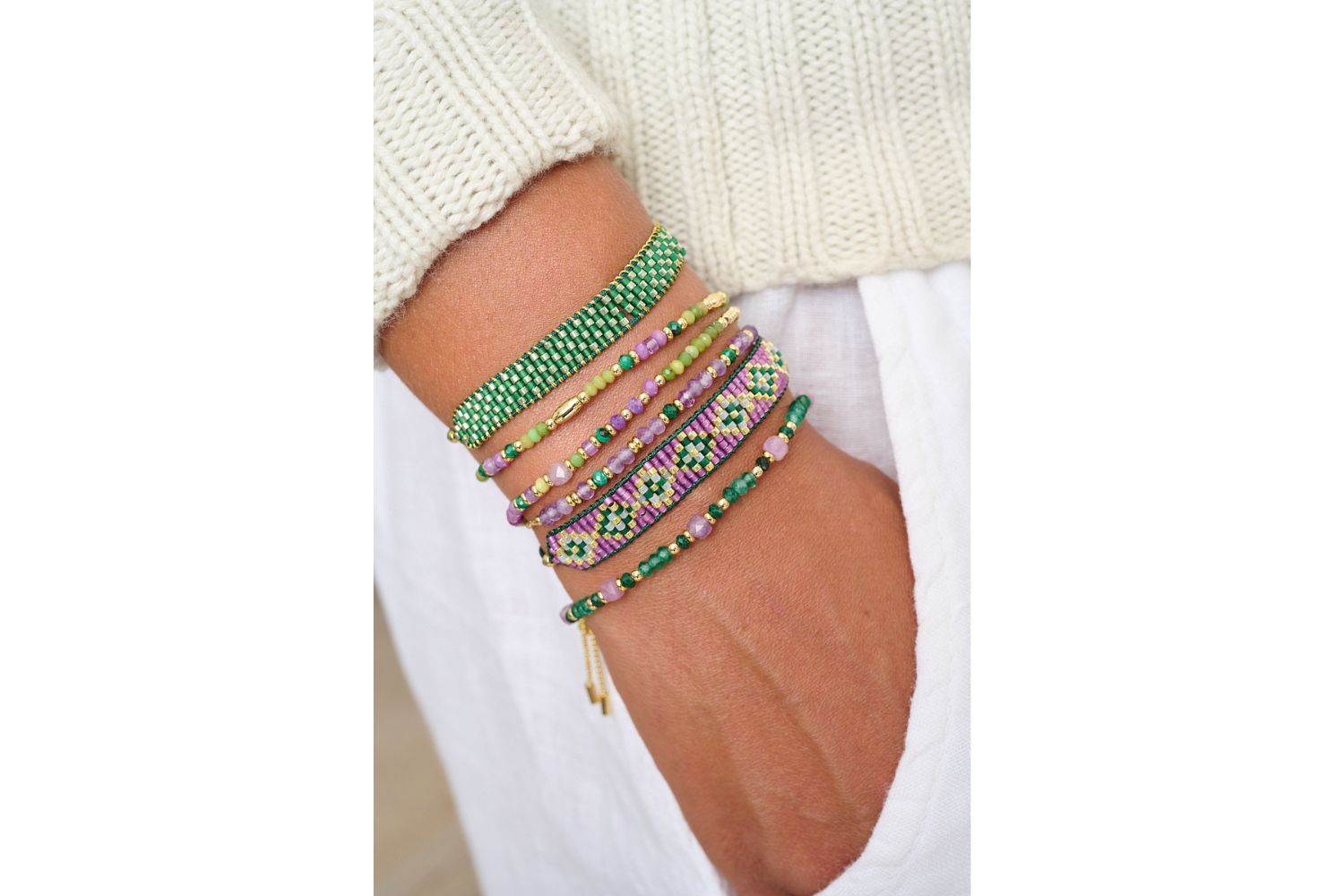 Nasrin February birthstone bracelet with green jade and amethyst featured on wrist with Boho Betty bracelet stack