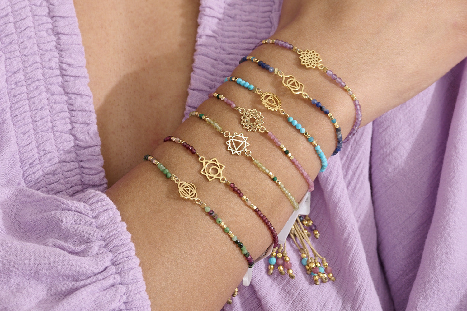 Peridot & Malachite Gold Solar Plexus Chakra Bracelet styled on wrist, showcasing the symbolic Solar Plexus Chakra charm and vibrant gemstone beads.