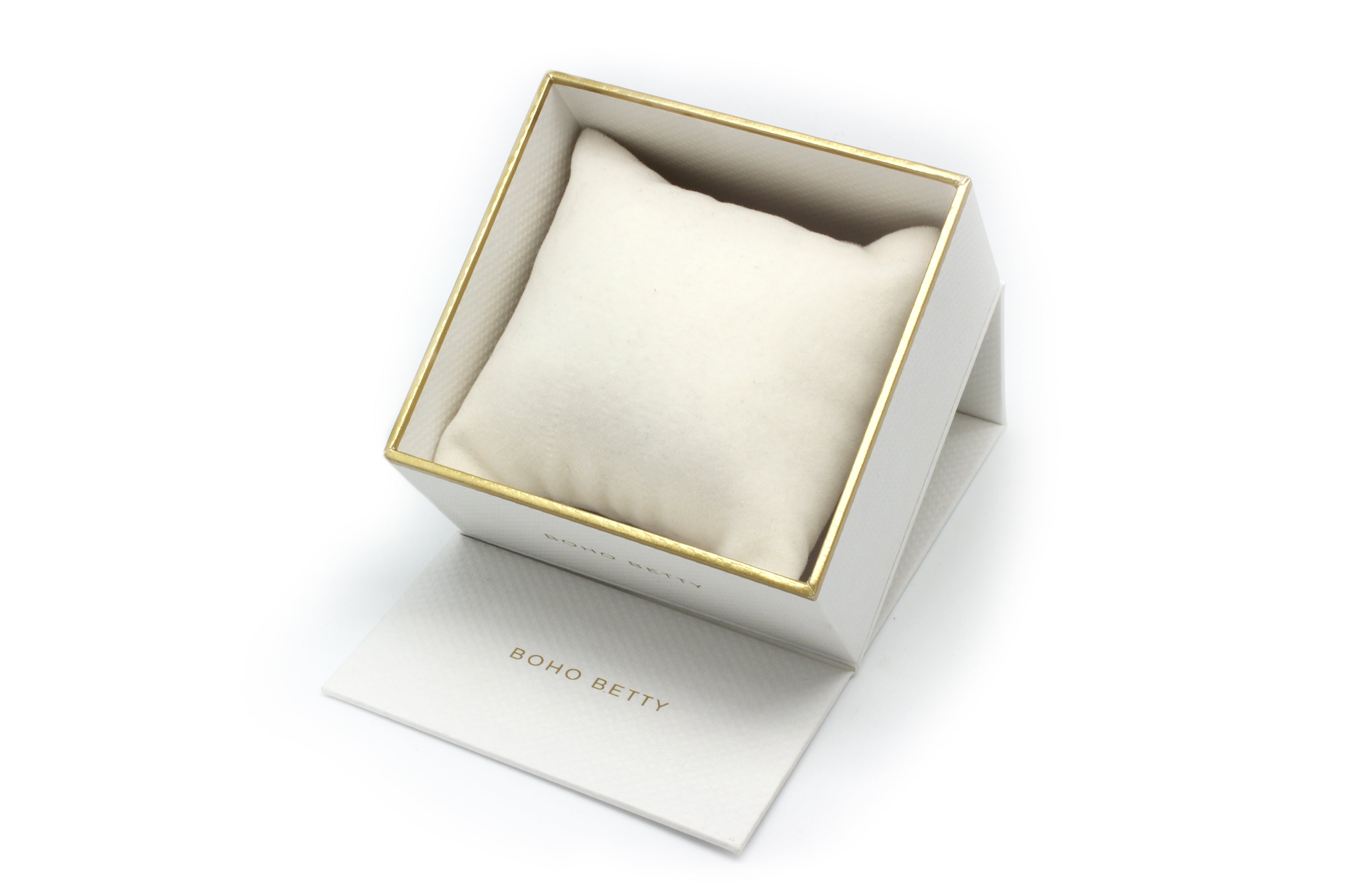Boho Betty luxury jewelry box featuring a white exterior with gold accents and an elegant cushion for displaying stacked bracelets. File Name: boho-betty-bracelet-stack-luxury-gift-box