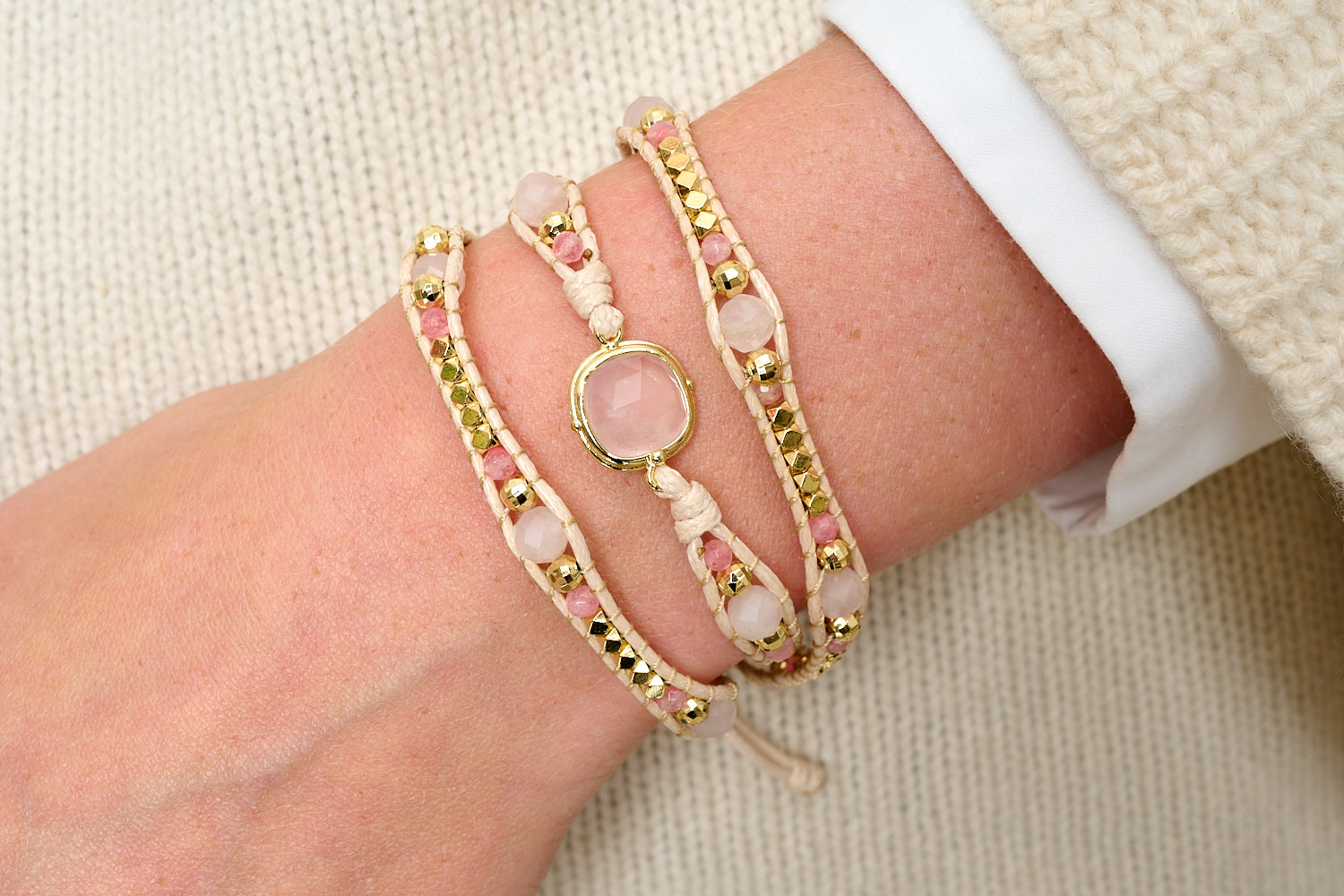 America Rose Quartz & Pink Tourmaline Gold Wrap Bracelet styled in a boho bracelet stack, featuring pink gemstones and gold beads.