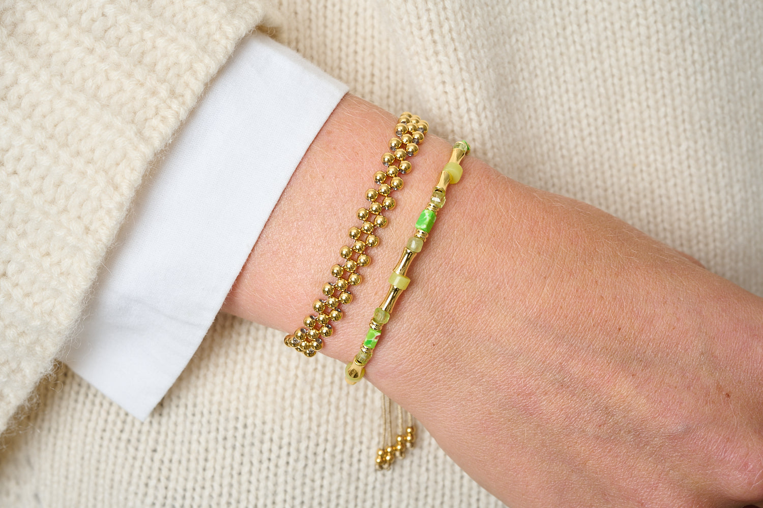 Chiara Gold & Peridot Gemstone Beaded Bracelet featured on wrist with Boho Betty stacking bracelets in green and gold tones.
