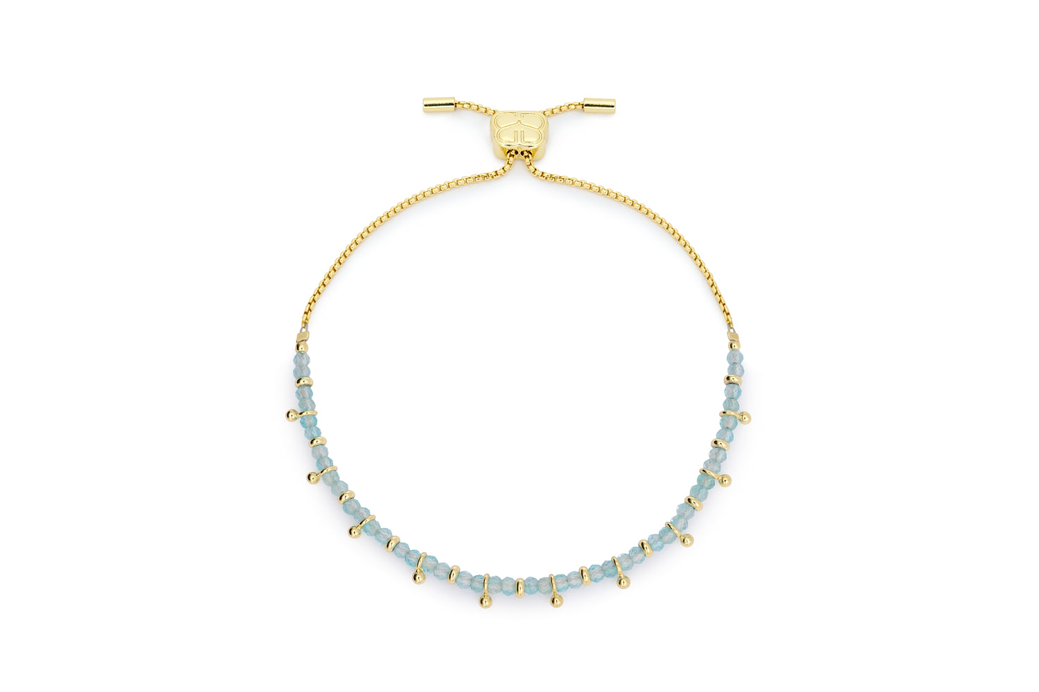 Harmony gold slider bracelet with blue topaz November birthstone beads and Boho Betty charm on white background