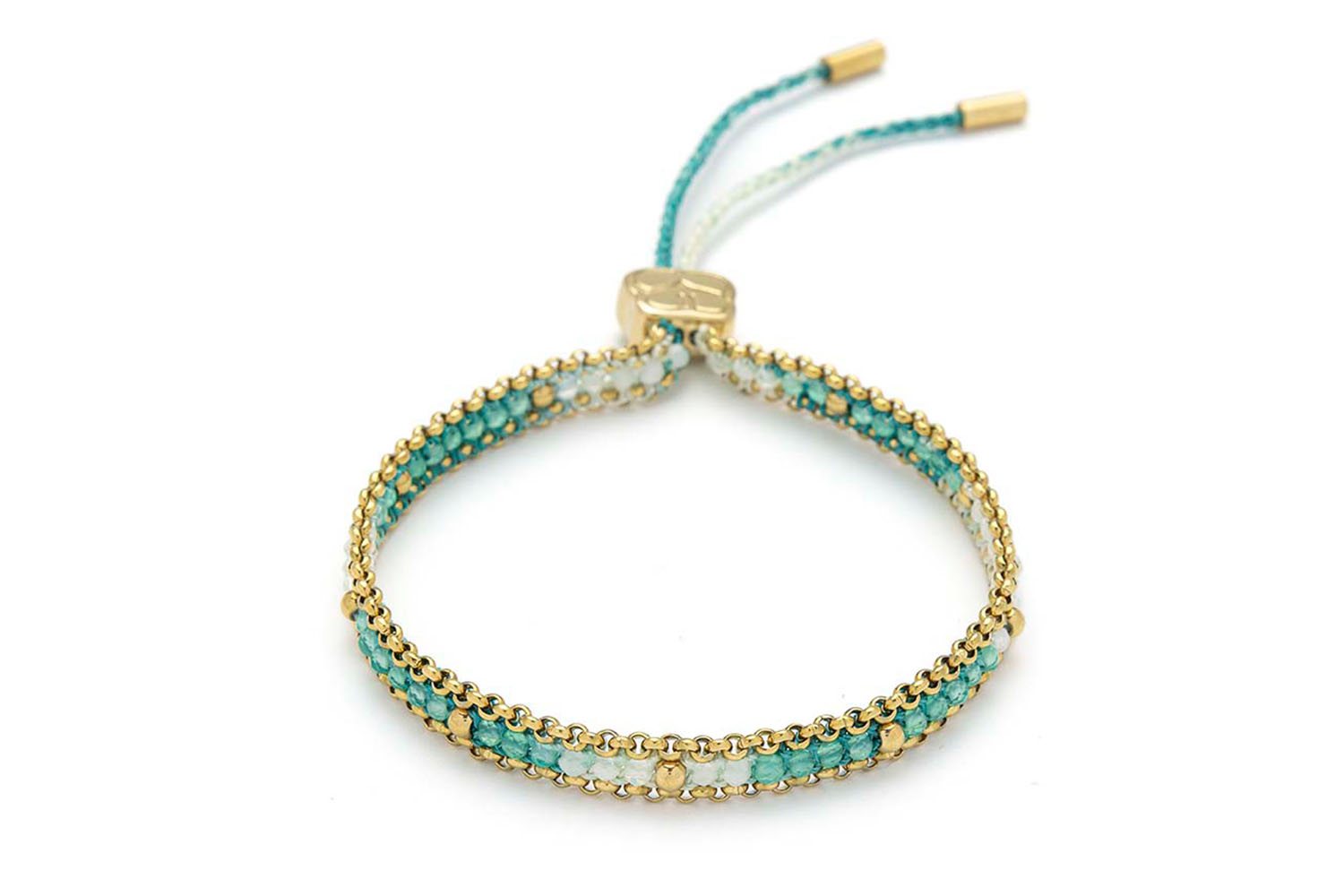 Helaine Turquoise Gold Friendship Bracelet styled with warm, sunlit layers and gold-toned jewelry for a serene summer look.