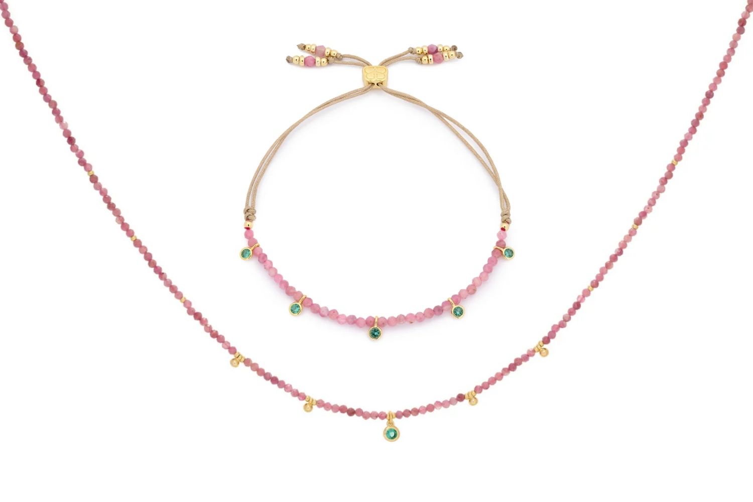 Holly Pink Tourmaline Necklace and Bracelet Set featuring pink tourmaline gemstone beads, emerald-green CZ charms, and 12k gold-plated accents, designed for elegant and joyful styling.