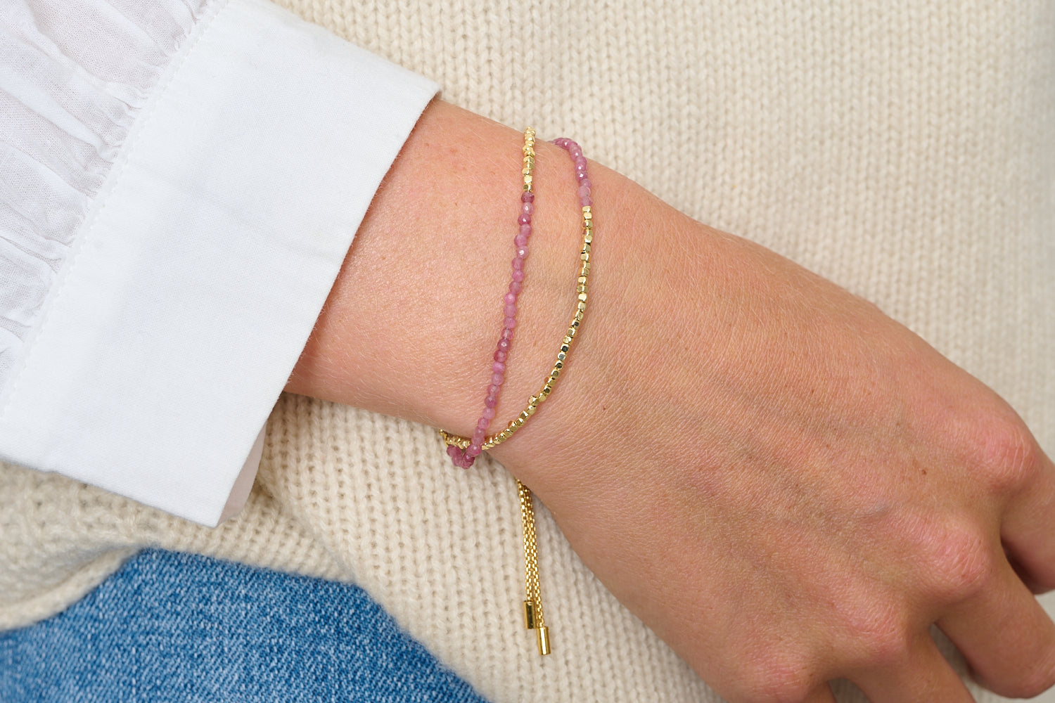 Juniper Gold & Pink Tourmaline Double Strand Bracelet featured on wrist with Boho Betty stacking bracelets in gold and pink gemstone tones.