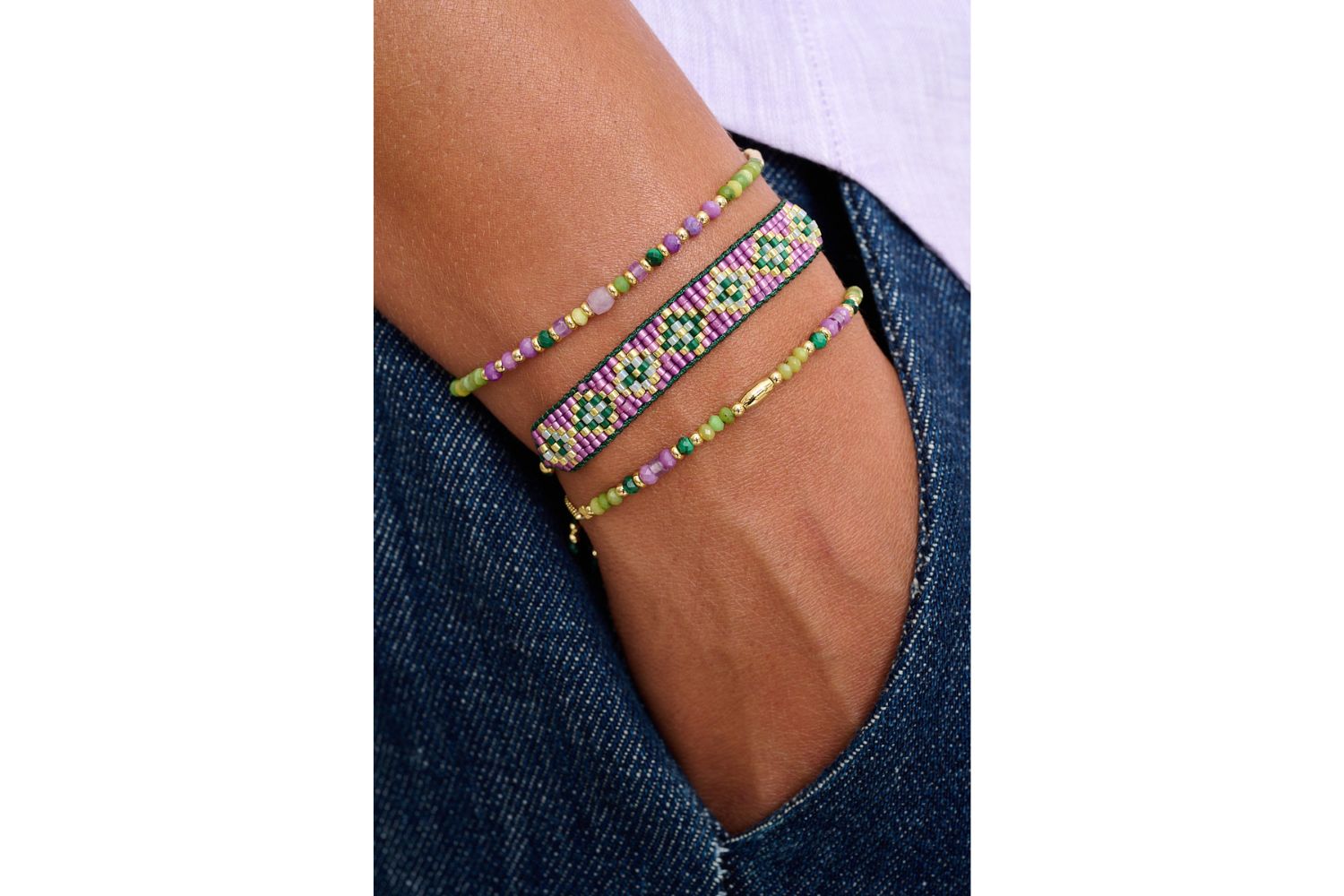 Kalina green jade and amethyst gemstone bracelet featured on wrist with Boho Betty stacking bracelets.