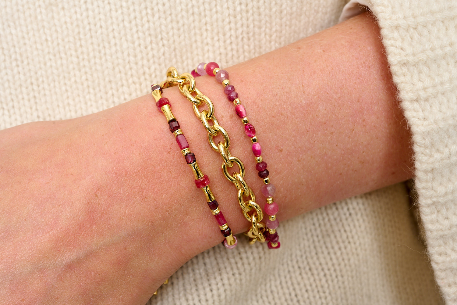 Laria Gold & Pink Tourmaline Gemstone Beaded Bracelet featured on wrist with Boho Betty stacking bracelets in gold and pink gemstone tones.