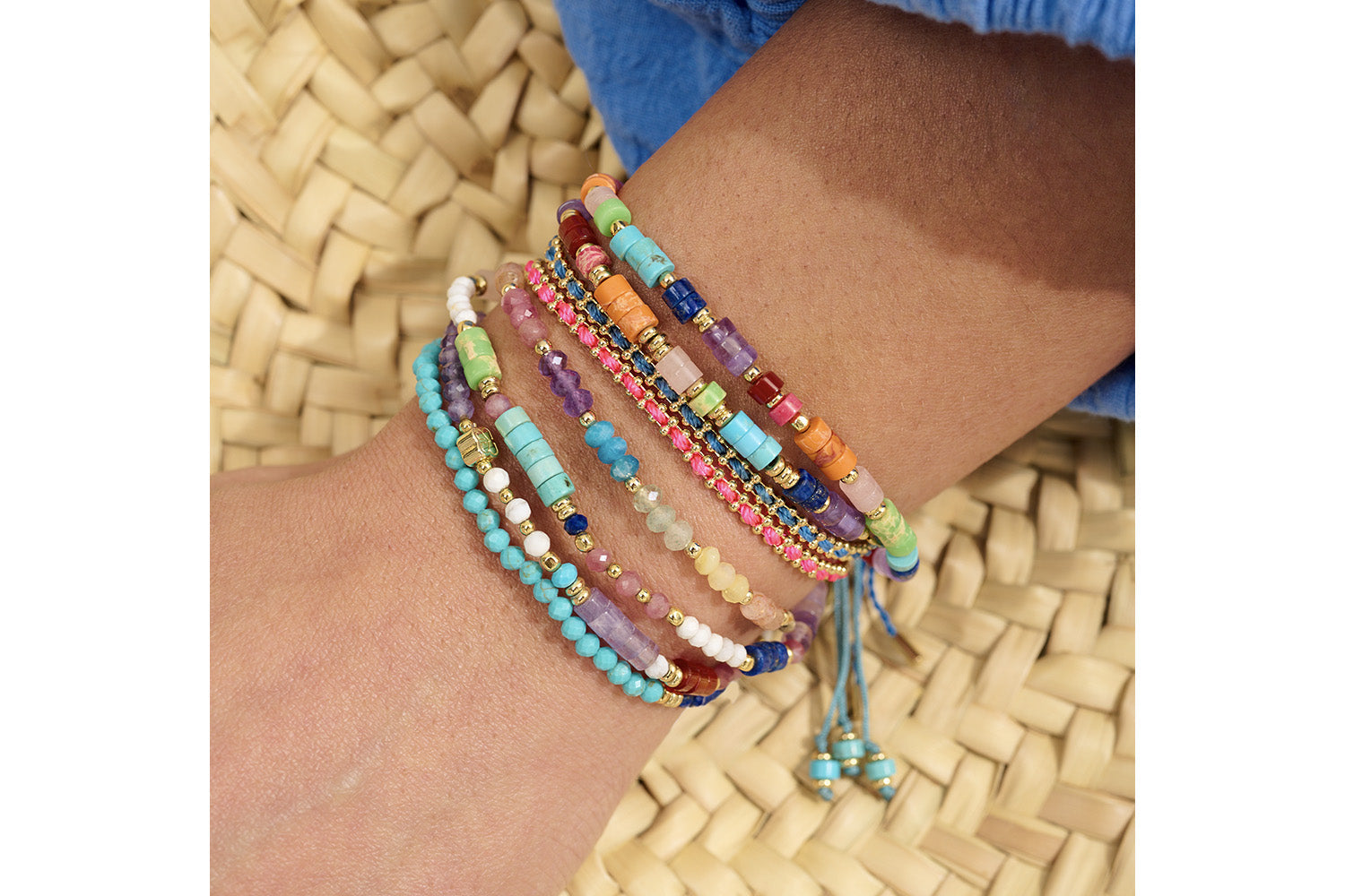 Marigold Rainbow Mix Gold Adjustable Bracelet styled on the wrist, showcasing vibrant rainbow gemstones and 12k gold-plated accents, perfect for layering or as holiday jewellery.