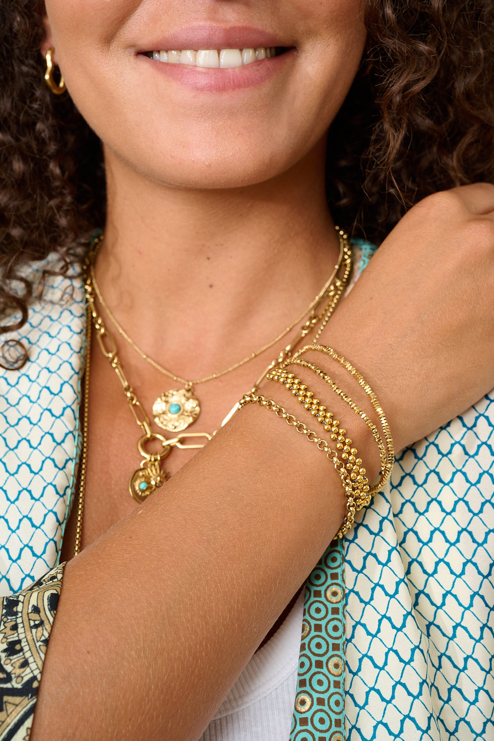 Marisol Gold Beaded Friendship Bracelet styled on the wrist with layered gold beads and neutral cord for a coastal boho look