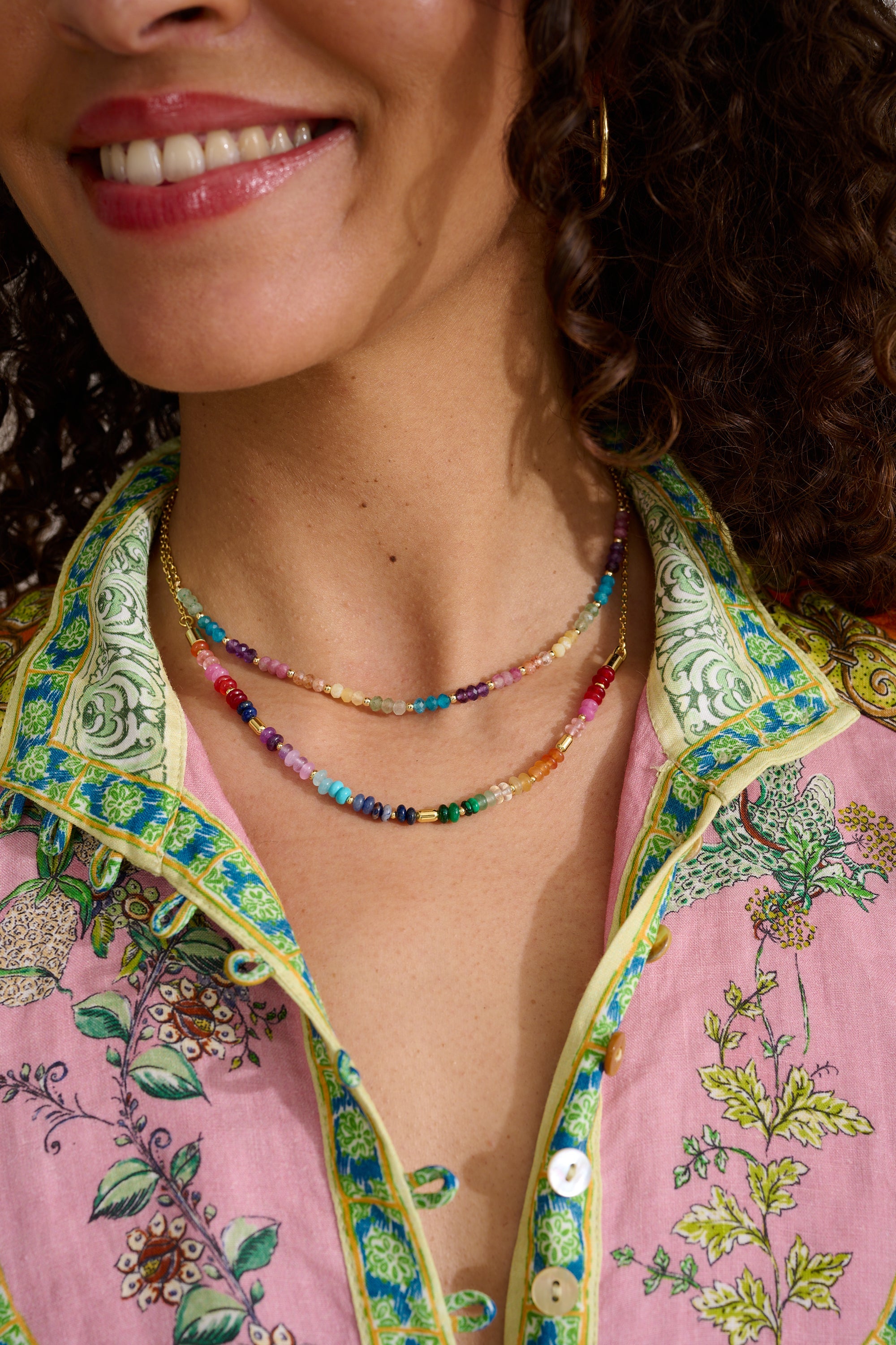 Molly Gold & Rainbow Beaded Gemstone Necklace styled for layering, showcasing vibrant rainbow gemstones and gold-plated accents—perfect for holidays or everyday wear.