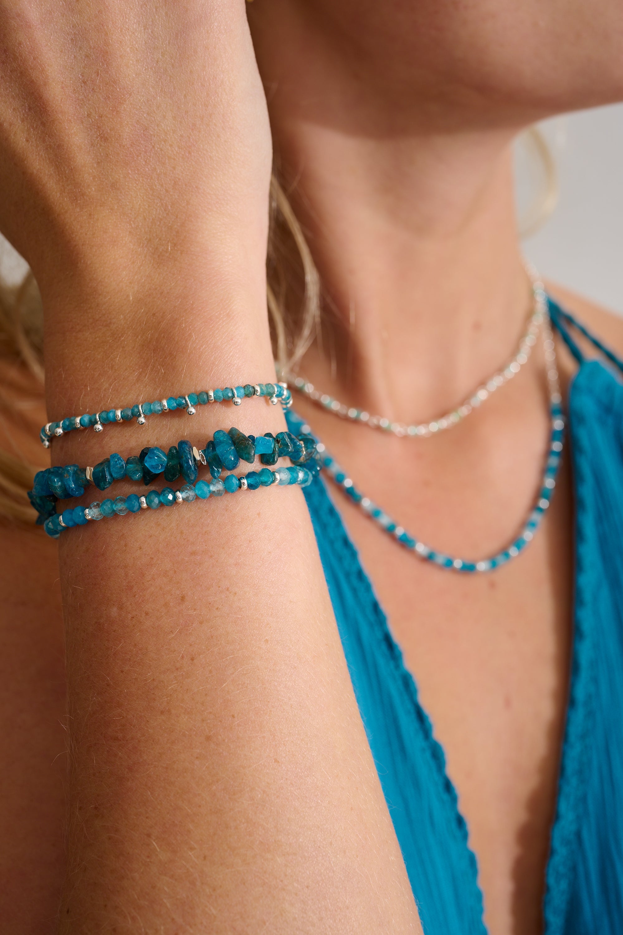 Sana Silver & Apatite Crystal Bracelet styled on the wrist, showcasing its vibrant blue apatite gemstones, silver accents, and effortlessly bold boho aesthetic.