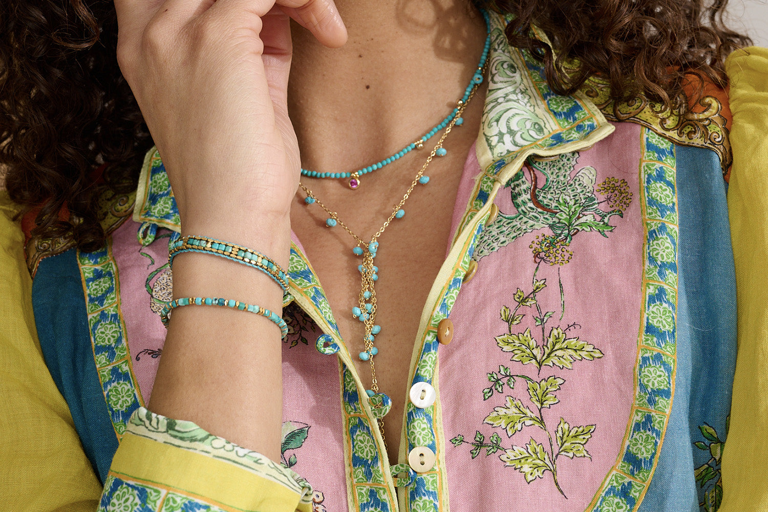 Valentina Turquoise Howlite Gold Bracelet styled on the wrist, showcasing turquoise howlite gemstones and waterproof gold PVD details designed for everyday wear and effortless layering.